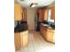 Full view of kitchen with ample cabinetry and granite countertops at 6274 Whispering Way # 130, Orlando, FL 32807