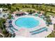 Large circular pool with plenty of lounge chairs at 1502 Moon Valley Dr, Davenport, FL 33896