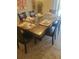 Elegant dining room with a large table, seating for eight, and glass top at 1502 Moon Valley Dr, Davenport, FL 33896