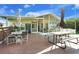 Relaxing patio with table and chairs, adjacent to the house at 3198 Tohopekaliga Dr, Saint Cloud, FL 34772