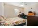 Bedroom with a floral-print bed, desk, and dresser at 3198 Tohopekaliga Dr, Saint Cloud, FL 34772