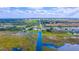 Wide aerial view of waterfront property with homes and canals at 3198 Tohopekaliga Dr, Saint Cloud, FL 34772