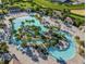 Large resort-style pool with lazy river and water features at 580 Pebble Beach Dr, Davenport, FL 33896