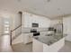 Spacious kitchen with granite island and stainless steel appliances at 1688 Tropical Palms Cir, Kissimmee, FL 34747