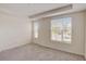 Bright and airy bedroom with neutral carpeting and large windows at 1688 Tropical Palms Cir, Kissimmee, FL 34747