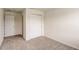 Simple bedroom with neutral wall and carpet, and a closet at 1688 Tropical Palms Cir, Kissimmee, FL 34747