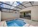 Private screened-in pool and spa in backyard at 1688 Tropical Palms Cir, Kissimmee, FL 34747