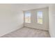 Bright bedroom with two windows and neutral carpet at 1688 Tropical Palms Cir, Kissimmee, FL 34747