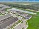 Aerial view showcasing community, lake, and surrounding landscape at 1688 Tropical Palms Cir, Kissimmee, FL 34747