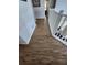 Upper level hallway with wood-look flooring at 2605 Emerald Island Blvd, Kissimmee, FL 34747