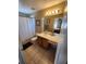 Bathroom with tub/shower, vanity, and tile floor at 2605 Emerald Island Blvd, Kissimmee, FL 34747