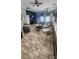 Community room with tables, chairs, and a TV at 2605 Emerald Island Blvd, Kissimmee, FL 34747