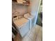 Laundry room with washer and dryer, shelving and hanging space at 2605 Emerald Island Blvd, Kissimmee, FL 34747
