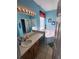 Bathroom with a garden tub, vanity, and shower at 2605 Emerald Island Blvd, Kissimmee, FL 34747