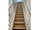 Wood-like stair treads leading to the upper level at 2605 Emerald Island Blvd, Kissimmee, FL 34747
