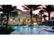 Community pool and clubhouse at sunset at 3937 Reed Grass Pl, Kissimmee, FL 34746