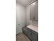 Laundry room with built-in bench and extra storage at 3937 Reed Grass Pl, Kissimmee, FL 34746