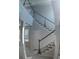Elegant staircase with dark wood and white spindles at 3937 Reed Grass Pl, Kissimmee, FL 34746