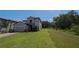 Two-story house with stone accents and a grassy yard at 3937 Reed Grass Pl, Kissimmee, FL 34746