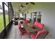 Large screened porch with seating and dining areas at 13900 Fox Glove St, Winter Garden, FL 34787