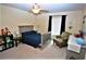 Bright bedroom with a double bed, chair, and ample closet space at 13900 Fox Glove St, Winter Garden, FL 34787