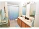 Shared bathroom with dual sinks and updated vanity at 13900 Fox Glove St, Winter Garden, FL 34787