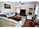 Spacious living room featuring hardwood floors and ample seating at 13900 Fox Glove St, Winter Garden, FL 34787