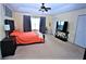 Bright Primary bedroom with a comfortable bed and plenty of closet space at 13900 Fox Glove St, Winter Garden, FL 34787
