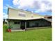 Two-story house with a large screened porch and grassy yard at 13900 Fox Glove St, Winter Garden, FL 34787