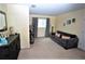 Guest bedroom with a sofa and dresser, perfect for overnight visitors at 13900 Fox Glove St, Winter Garden, FL 34787