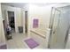 Main bathroom with a bathtub and shower, and updated tile at 13900 Fox Glove St, Winter Garden, FL 34787
