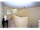 Upstairs hallway with neutral walls and carpet, leading to bedrooms at 13900 Fox Glove St, Winter Garden, FL 34787