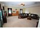 Spacious Gathering room featuring a large sectional sofa and ample natural light at 13900 Fox Glove St, Winter Garden, FL 34787