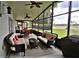Spacious screened porch, wicker furniture and grill at 13900 Fox Glove St, Winter Garden, FL 34787
