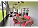 Relaxing screened porch with seating area and dining table at 13900 Fox Glove St, Winter Garden, FL 34787