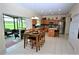 Eat-in kitchen with sliders to screened patio overlooking the golf course at 13900 Fox Glove St, Winter Garden, FL 34787