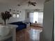 Living room with blue sofa and decorative shelving at 924 Derbyshire Dr, Kissimmee, FL 34758