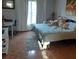 Bedroom with king-size bed, tile floors, and large window at 924 Derbyshire Dr, Kissimmee, FL 34758
