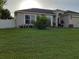One story home with a two car garage and a landscaped lawn at 924 Derbyshire Dr, Kissimmee, FL 34758