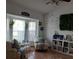 Living room with comfy seating and large wall clock at 924 Derbyshire Dr, Kissimmee, FL 34758