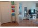 Bright living room with tile floors, TV stand, and access to other rooms at 924 Derbyshire Dr, Kissimmee, FL 34758