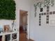 Hallway with access to other rooms and decorative wall art at 924 Derbyshire Dr, Kissimmee, FL 34758