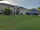 One story home with a two car garage and a landscaped lawn at 924 Derbyshire Dr, Kissimmee, FL 34758