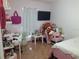 Bedroom with a bed, desk, and plush toys at 924 Derbyshire Dr, Kissimmee, FL 34758