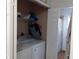 Laundry room with washer, dryer, and additional storage at 924 Derbyshire Dr, Kissimmee, FL 34758