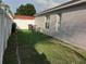 Large backyard with grassy area and privacy fence at 924 Derbyshire Dr, Kissimmee, FL 34758