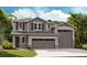 Two-story house with gray siding, two-car garage, and landscaping at 3860 Bannock Ave, Tavares, FL 32778