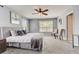 Spacious Primary bedroom with plush carpeting and plenty of natural light at 6943 Cupseed Ln, Harmony, FL 34773