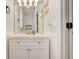 Stylish bathroom with white vanity, floating shelves, and updated fixtures at 6943 Cupseed Ln, Harmony, FL 34773
