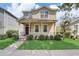 Two-story house with front porch at 6943 Cupseed Ln, Harmony, FL 34773